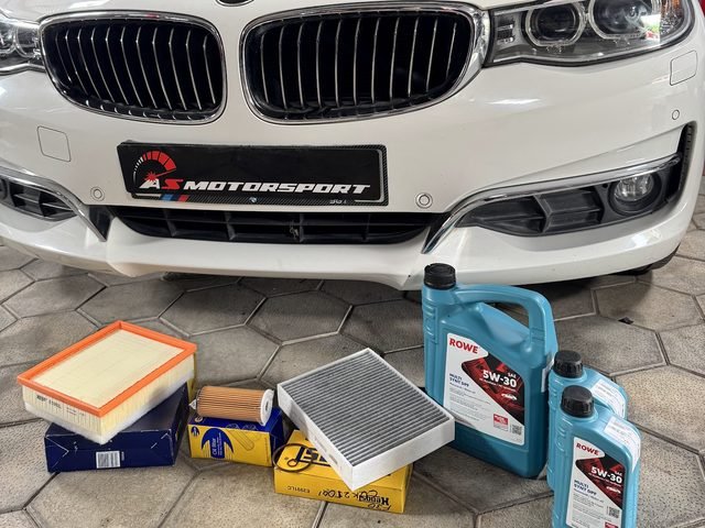 BMW 3 Series GT in for service, with ROWE oil and new filters laid out