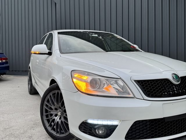 White Skoda Octavia vRS on aftermarket wheels outside the AS Motorsport workshop