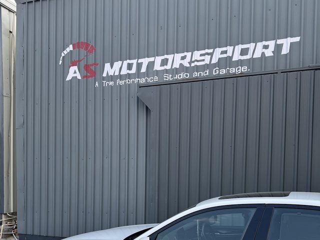 The AS Motorsport building in Madhapur with its sign: A True Performance Studio and Garage